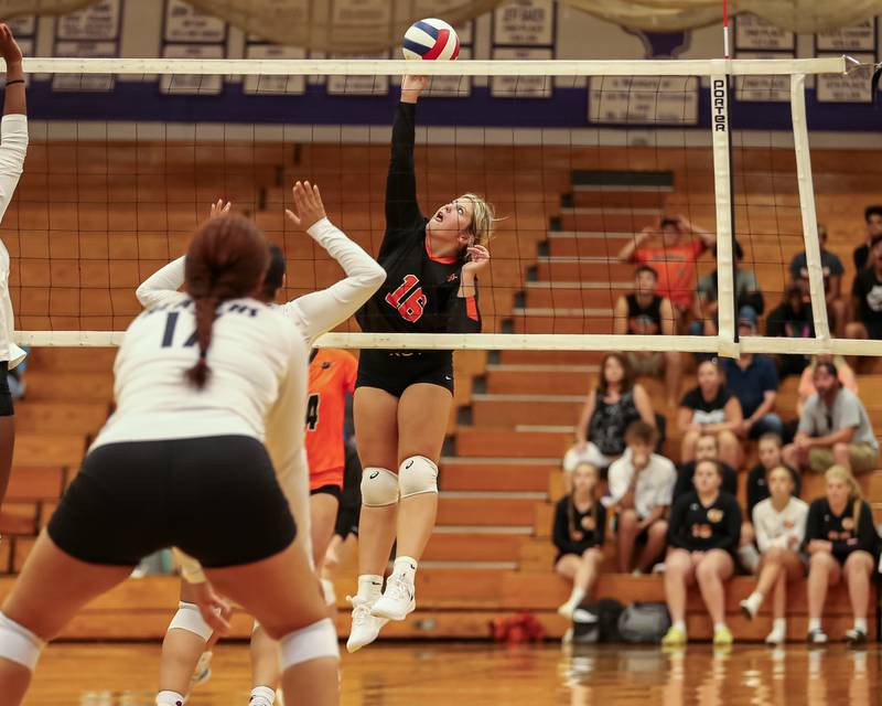 Sandwich's Lexie Randa (16) spikes the ball during volleyball match between Sandwich at Plano.  August 21, 2023.