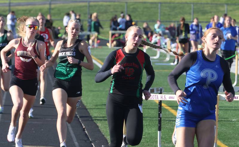 (From left) Morris's Aubrey Lines, Rock Falls's Kat Scott, L-P's Aubrey Urbanski, and Princeton's Jocelyn Stouss run the 800 meters during the Class 2A Sectional track meet on Wednesday, May 13, 2026 in the Jeff Prusator Athletic Complex at Mendota High School.