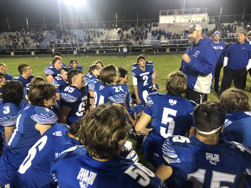 Princeton coach Ryan Pearson addresses his troops after Friday's 58-28 win over Peotone in the 3A Playoffs.