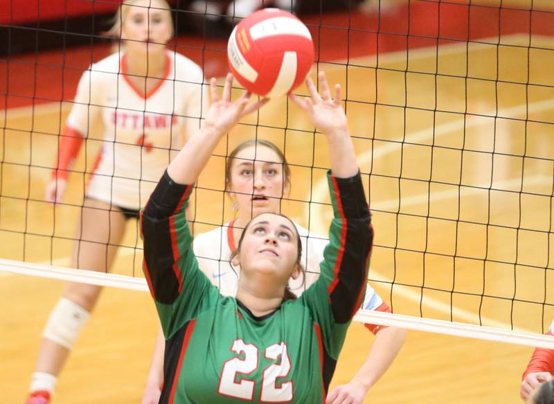 L-P's Carly Garretson sets the ball in the air against Ottawa on Thursday, Oct. 17, 2024 in Kingman Gym at Ottawa High School.
