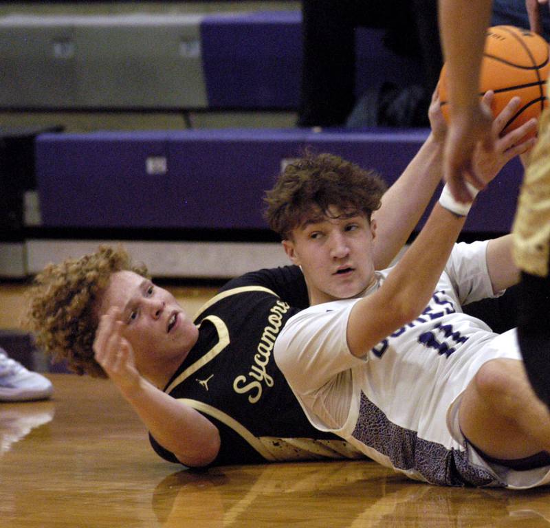 Dixon's Brody Nicklaus grabs a loose mall. The Dixon Dukes hosted  the Sycamore Spartans in a non-conference game  on Friday, December 19th, 2025.