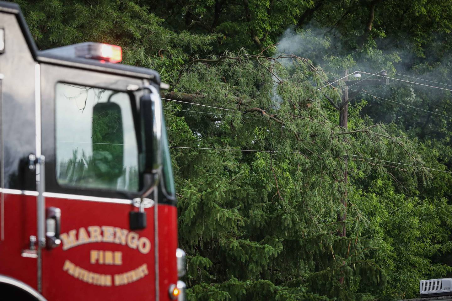 A quick-moving storm on July 10, 2025 downed power lines and trees in the Marengo area.