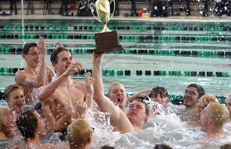 Swimmers from Car-Grove co-op celebrate after winning the Fox Valley Conference Boys Swimming Invite at Woodstock North on Saturday.