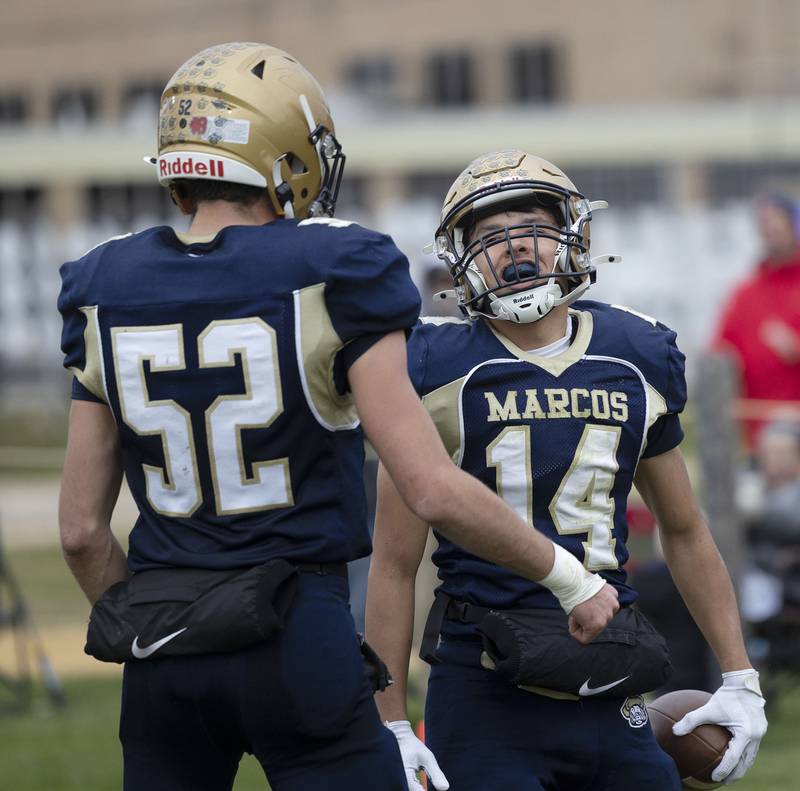 Polo’s Jordan Reed celebrates a TD with teammate Ethan Dewey against Hiawatha Saturday, Nov. 1, 2025, in the 8-man football playoff quarterfinals.