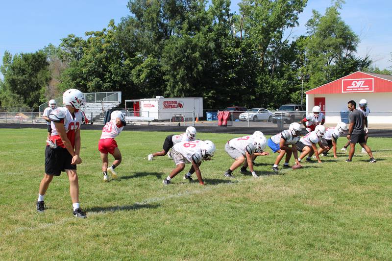 The Streator Bulldogs football team readies presnap at practice Wednesday, July 16, 2025, at Doug Dieken Stadium in Streator.