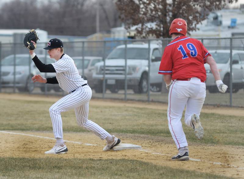 Fulton first baseman Jacob Huisenga catches a throw before Morrison's Tyler Peters makes it to the base during a Friday, March 21, 2025 game at Drives Field in Fulton.