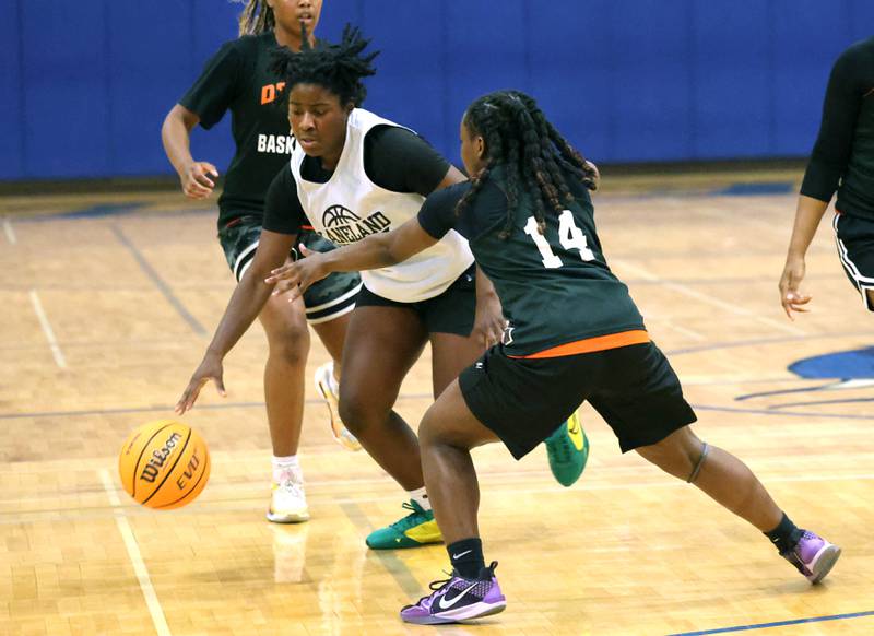 Kaneland’s Amani Meeks drives by a DeKalb defender Thursday, June 12, 2025, in the Geneva High School Varsity Summer League.