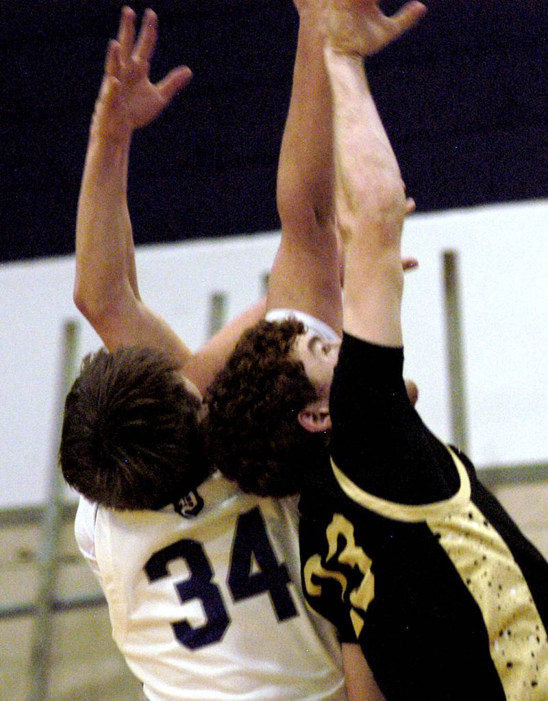 Jakob Nicklaus of Dixon and Sycamore's  Adian Mesenbrink fight for a rebound. The Dixon Dukes hosted  the Sycamore Spartans in a non-conference game  on Friday, December 19th, 2025.