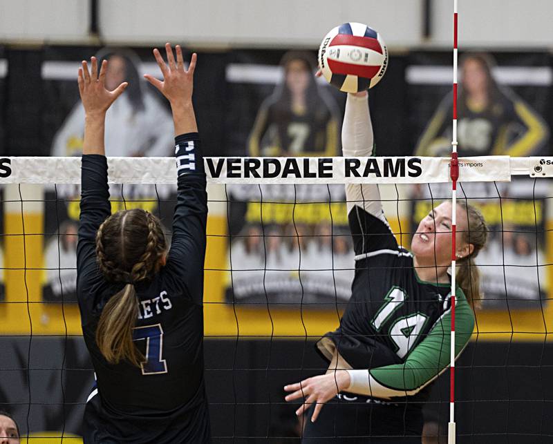 Rock Falls’ Nicolette Udell spikes against Newman’s Makenzie Duhon Thursday, Oct. 26, 2023 in the class 2A regional finals at Riverdale.