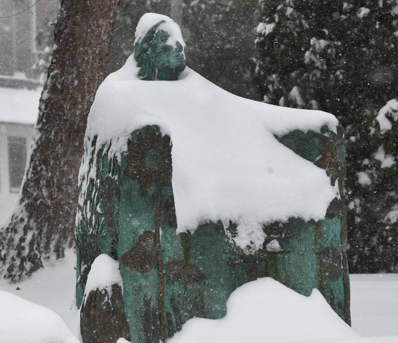 The Bountiful Bench statue was covered with snow on Saturday, Nov. 29, 2025 as several inches fall across the Northern Illinois region. This sculpture, created by Christina Murphy in 2008, graces the lawn of the Oregon Public Library and was inspired by the beauty of the Rock River and woman of nature.