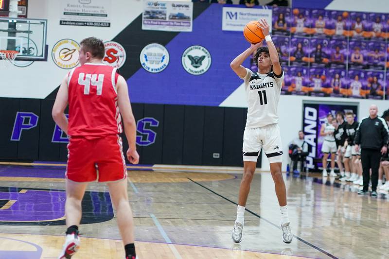 Kaneland’s Evan Frieders (11) shoots a three pointer against Streator during a semi-final basketball game in the 61st annual Plano Christmas Classic at Plano High School on Friday, December 27, 2024.