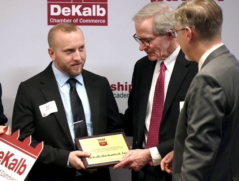 Kurt Mattson, (left) from DeKalb Mechanical, accepts the Business of the Year Award from DeKalb city manager Bill Nicklas Thursday, Feb. 5, 2026, during the DeKalb Chamber of Commerce Annual Celebration Dinner at Faranda's Banquet & Conference Center.