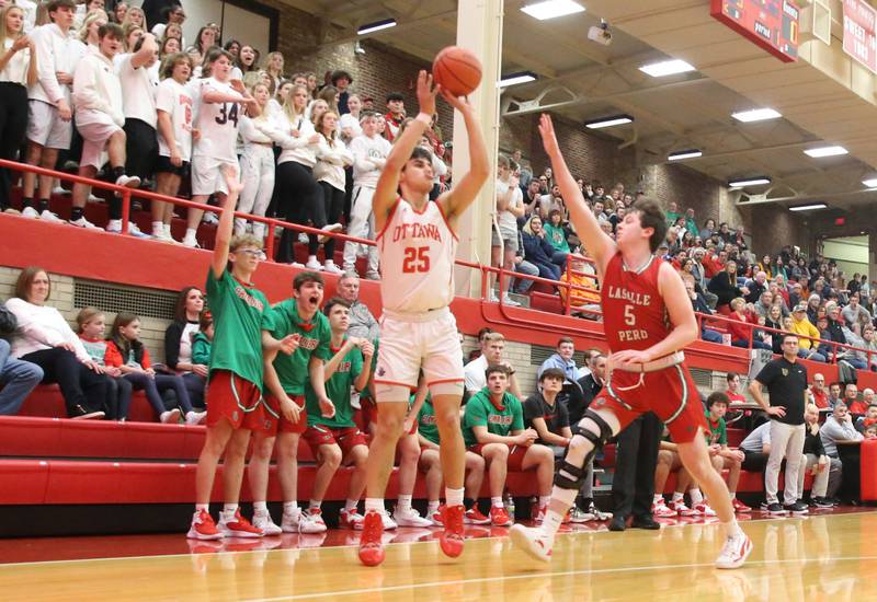 Ottawa's Cooper Knoll shoots a jump shot over L-P's Tommy Hartman in Kingman Gymnasium on Friday, Feb. 10, 2023 at Ottawa High School.