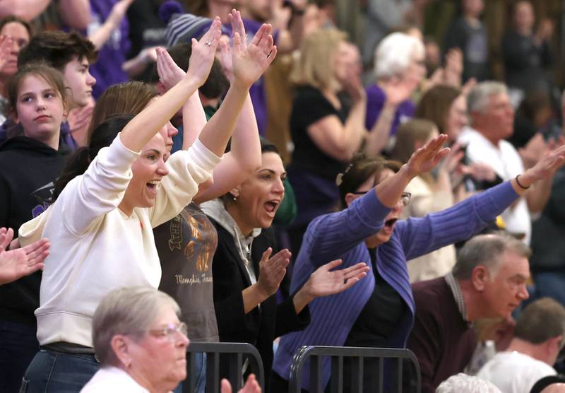 Dixon fans celebrate as time ticks off the clock Thursday, Feb. 22, 2024, during their Class 3A sectional final win over Kaneland at Sycamore High School.