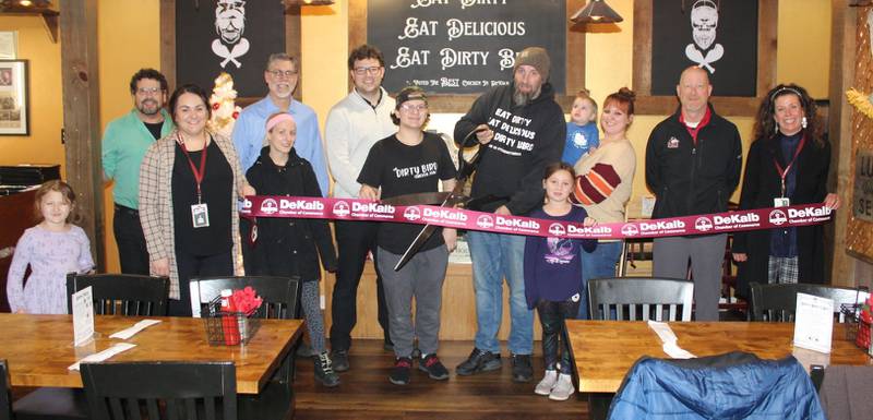 The DeKalb Chamber of Commerce welcoming The Dirty Bird 815 with a ribbon-cutting.