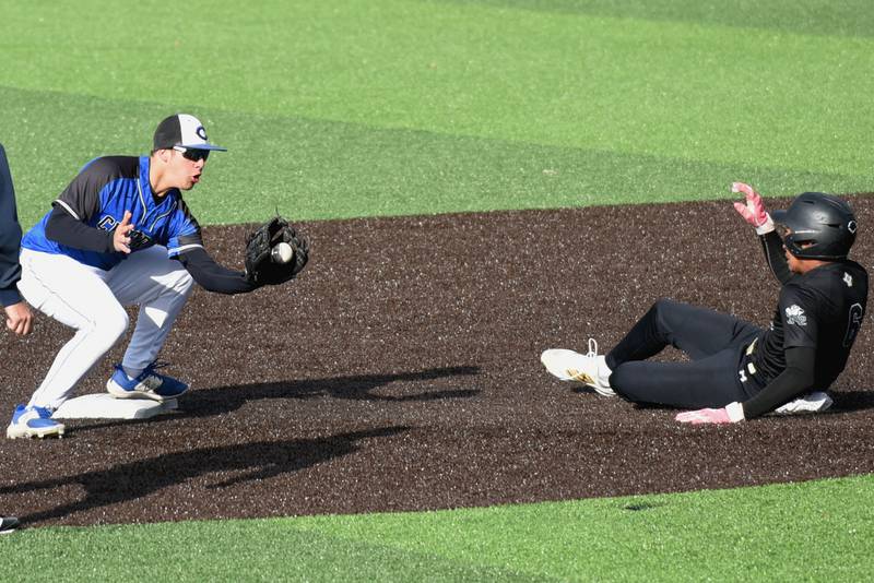 Central's Kaden LaFine, left, fields a throw at second base and waits to tag Bishop McNamara's Gavin Jones during the Class 2A Herscher Regional semifinals Thursday, May 22, 2025.
