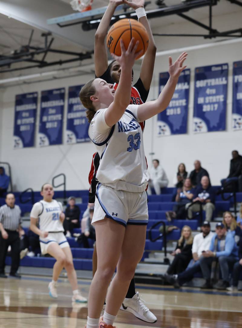 Nazareth's Molly Moore (33) puts up a shot during the girls varsity basketball game between Bolingbrook high school and Nazareth Academy on Monday, Jan. 12, 2026 in La Grange Park.