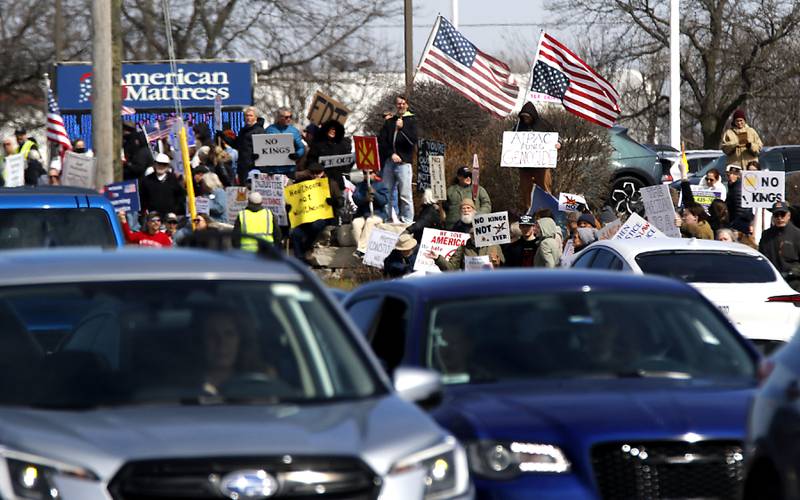 Protesters line State Route 31 near the intersection of McCullom Lake Road in McHenry to protest their discontent with President Donald Trump and his administration's policies on Saturday, March 28, 2026, during the McHenry County No Kings Protest. According to an organizer, over 4,000, people took part in the protest.