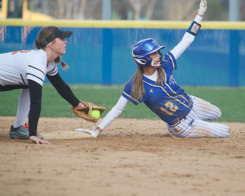 St. Charles East's Addison Wolf tags out Wheaton North's Abby Del Preto at second base on Monday, April 21, 2025 In Wheaton.