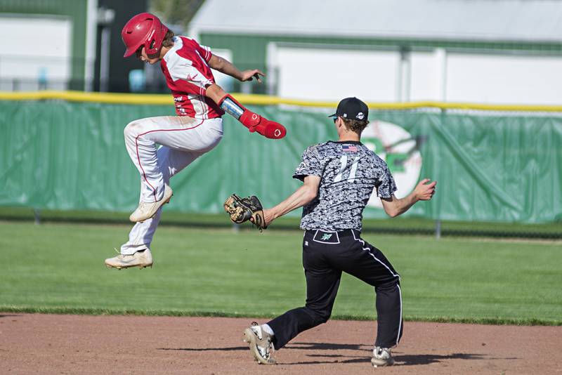 Oregon’s Logan Weems attempts to avoid a tag by Rock Falls' Gavin Sands Monday, May 16, 2022 in the IHSA baseball quarterfinals.