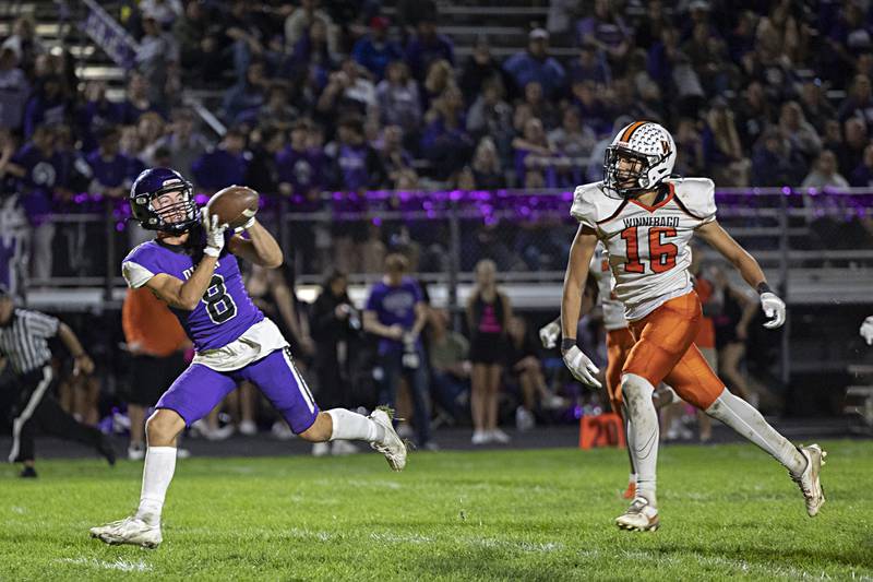 Dixon’s Tyson Dambman hauls in a touchdown catch early in the second half against Winnebago Friday, Sept. 29, 2023 in Dixon.