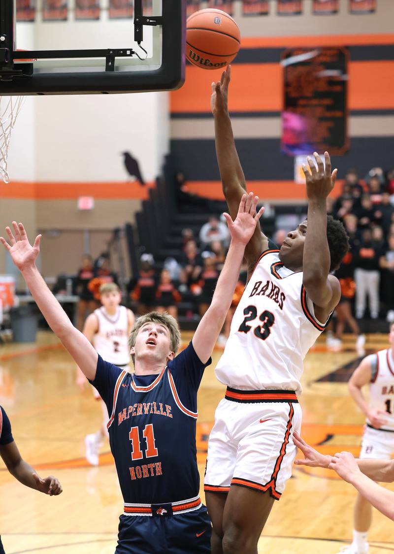 DeKalb’s Davon Grant shoots over Naperville North's Jack Kallstrand during their game Friday, Dec. 8, 2023, at DeKalb High School.