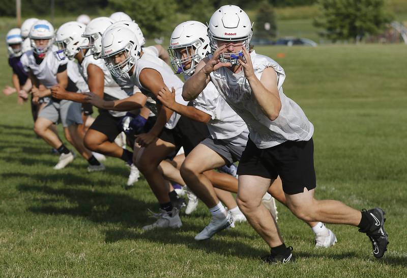 Hampshire’s Cole Klawikowski takes part in a running drill during the first day of football practice Monday, August 7, 2023, at Hampshire High School.