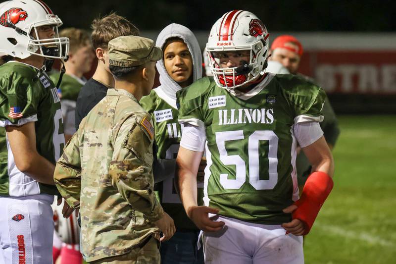 David Harcharik of Streator talks to Sergeant Kody Montoya of the Illinois Army National Guard on Friday, October 4, 2024 at Streator high school in Streator.