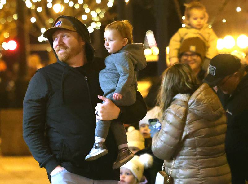 Visitors check out the windows as they walk down State Street Friday, Nov. 21, 2025, during Moonlight Magic in downtown Sycamore.