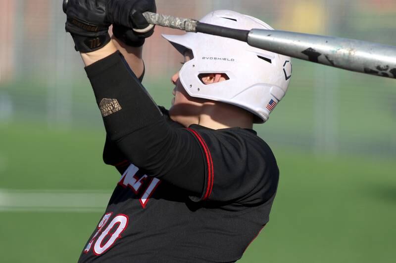 Huntley’s Haiden Janke follows through on an RBI single in varsity baseball at McHenry Friday night.