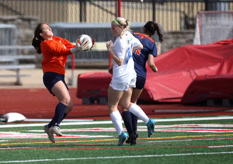 Oswego goalkeeper Amara Loghmani makes a save during a Naperville Invitational game against Geneva at Naperville Central on Saturday, April 23, 2022.