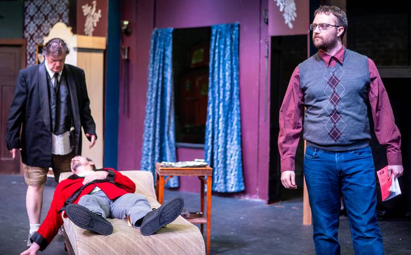 Stage Coach Players cast members rehearsing a scene for their upcoming production of “The Play That Goes Wrong"