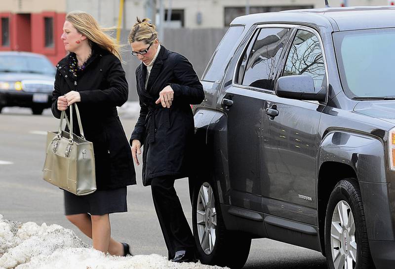 Rita Crundwell, right, the former comptroller of Dixon, Ill., who pleaded guilty in November 2012 to wire fraud, admitting she stole nearly $54 million from the city of Dixon, arrives with her attorney Kristin Carpenter at the federal courthouse for her sentencing in Rockford, Ill., Thursday, Feb. 14, 2013.