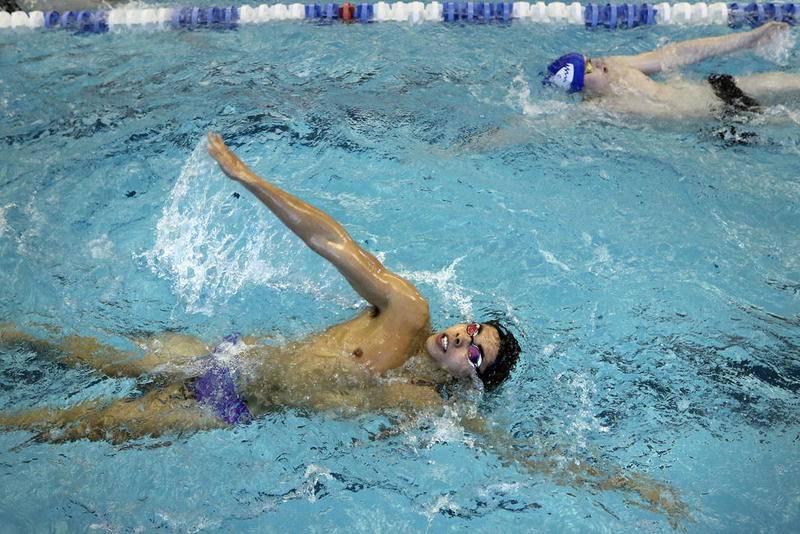 Ben Castro, front, and Danial Sanahurskyj work on their backstroke during boys swimming practice for the Cary-Grove co-op team at the Sage YMCA on Wednesday in Crystal Lake.