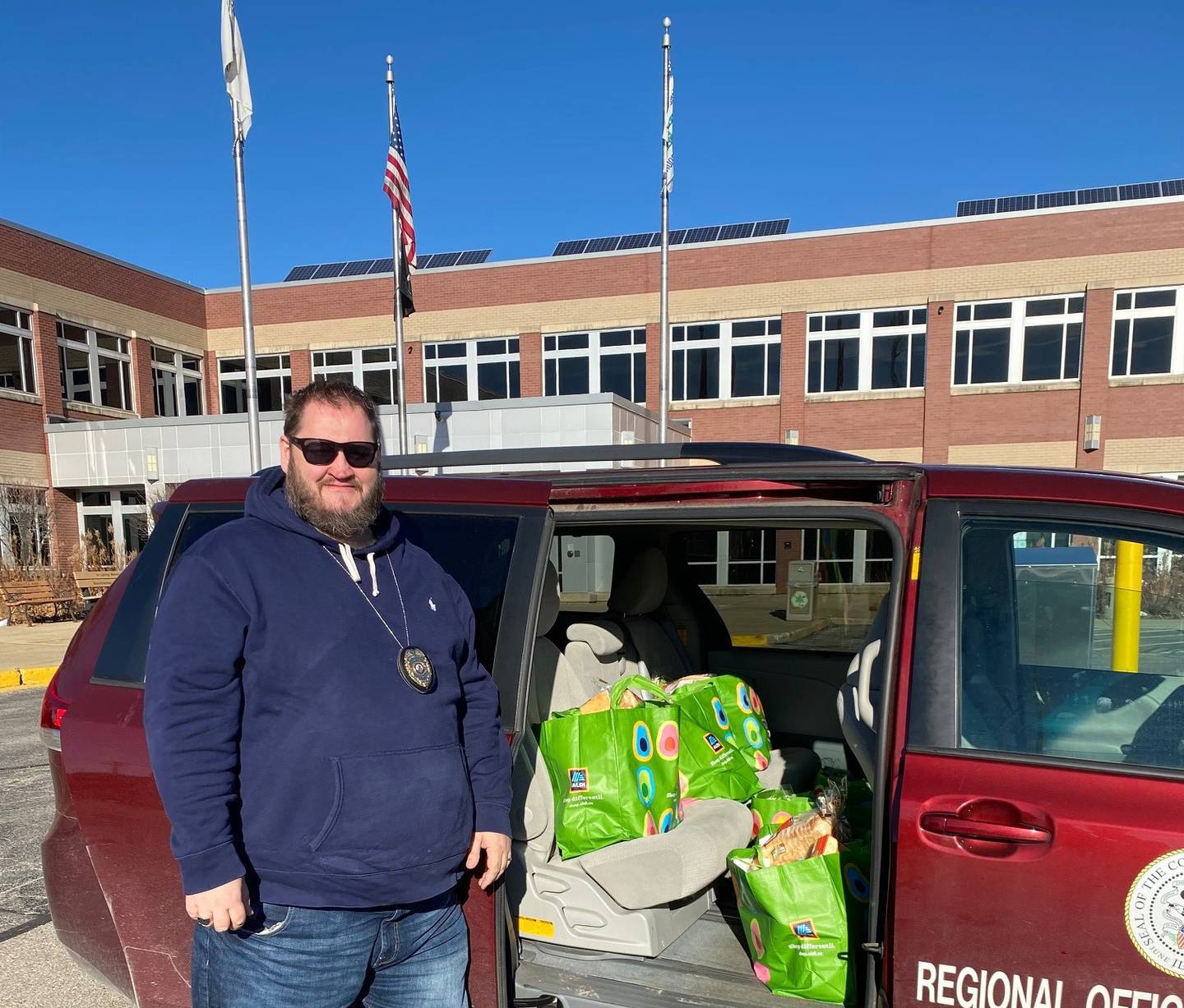 McHenry County Regional Office of Education truancy officer Tim Dempsey has helped garner private donations to provide 25 families holiday meals, six of which are being shown getting delivered Friday.