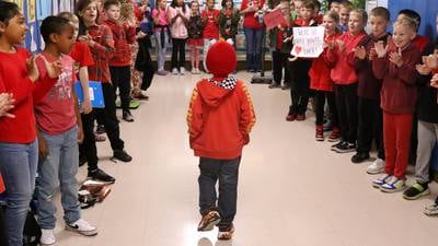  Photos: First grader Marshall Morong gets warm welcome back to school after heart transplant
