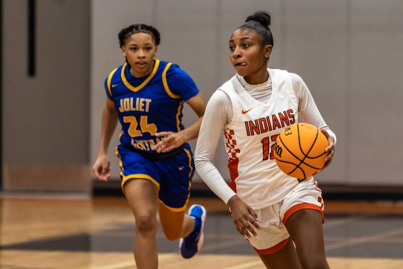 Minooka's Naya Carter drives the ball down court during a WJOL Girls Basketball Tournament game against Joliet Central at Minooka on Nov. 19, 2025