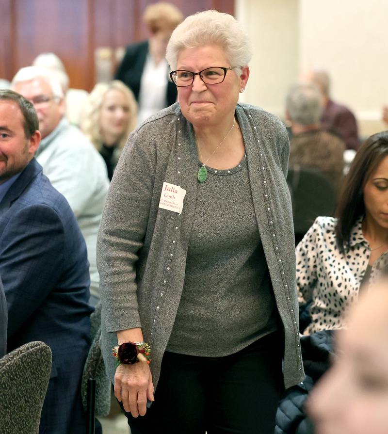 Women of Accomplishment honoree Julia Lamb comes to the stage to be recognized Tuesday, Oct. 18, 2022, during the Athena and Women of Accomplishment Award Reception at the Barsema Alumni and Visitors Center at Northern Illinois University in DeKalb.