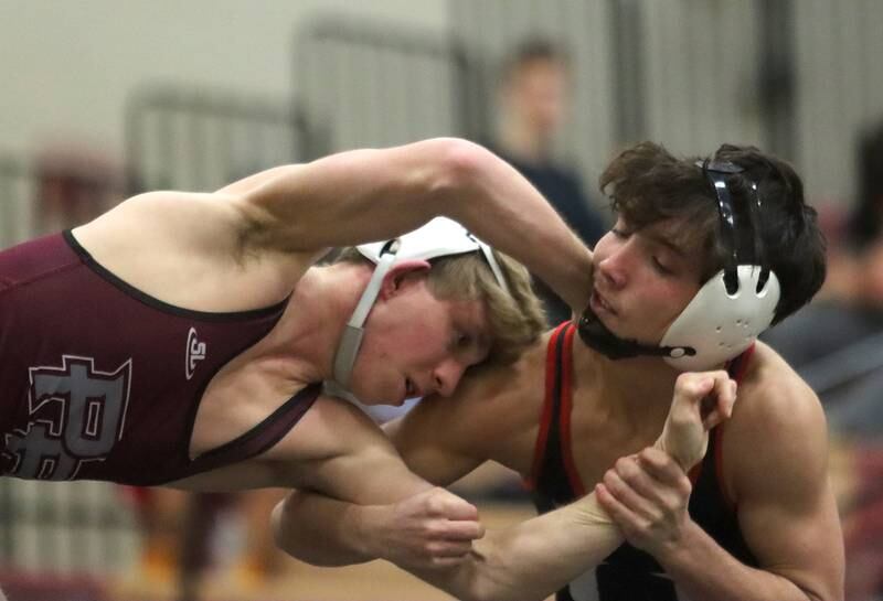 Huntley’s Cameron Abordo, right, battles Prairie Ridge’s  Jake Lowitzki at 120 pounds in varsity wrestling on Thursday, Jan. 23, 2025, at Huntley High School in Huntley.