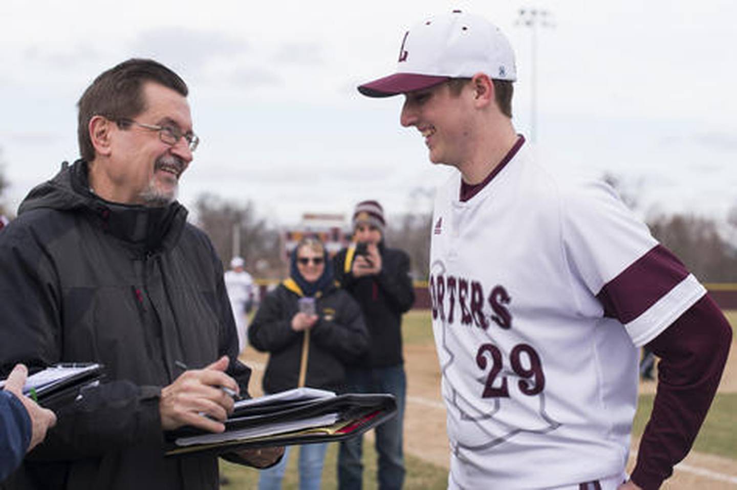 Joliet Herald News sports reporter, Dick Goss interviews Lockport pitcher Rich Jesse Saturday at Ed Flink Field in Lockpork.