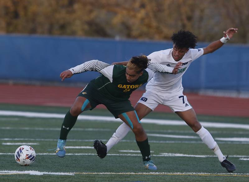 Crystal Lake South's Ali Ahmed battles with Peoria Notre Dame's Kayden Hudson for control of the ball during the IHSA Class 2A state championship soccer match on Saturday, Nov. 4, 2023, at Hoffman Estates High School.