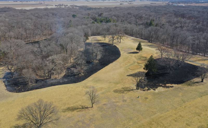 Crews burn off part of the green area for a controlled burn on Monday, March 2, 2026 at Deer Park Golf Club in Oglesby.