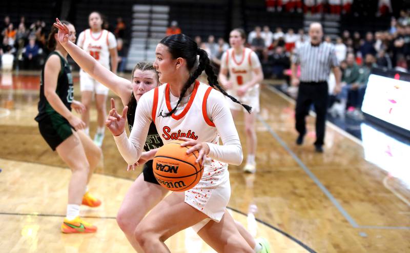 St. Charles East's Sofia O’sullivan drives toward the basket during a Class 4A St. Charles East Sectional semifinal against Glenbard West on Tuesday, Feb. 25, 2025 in St. Charles.