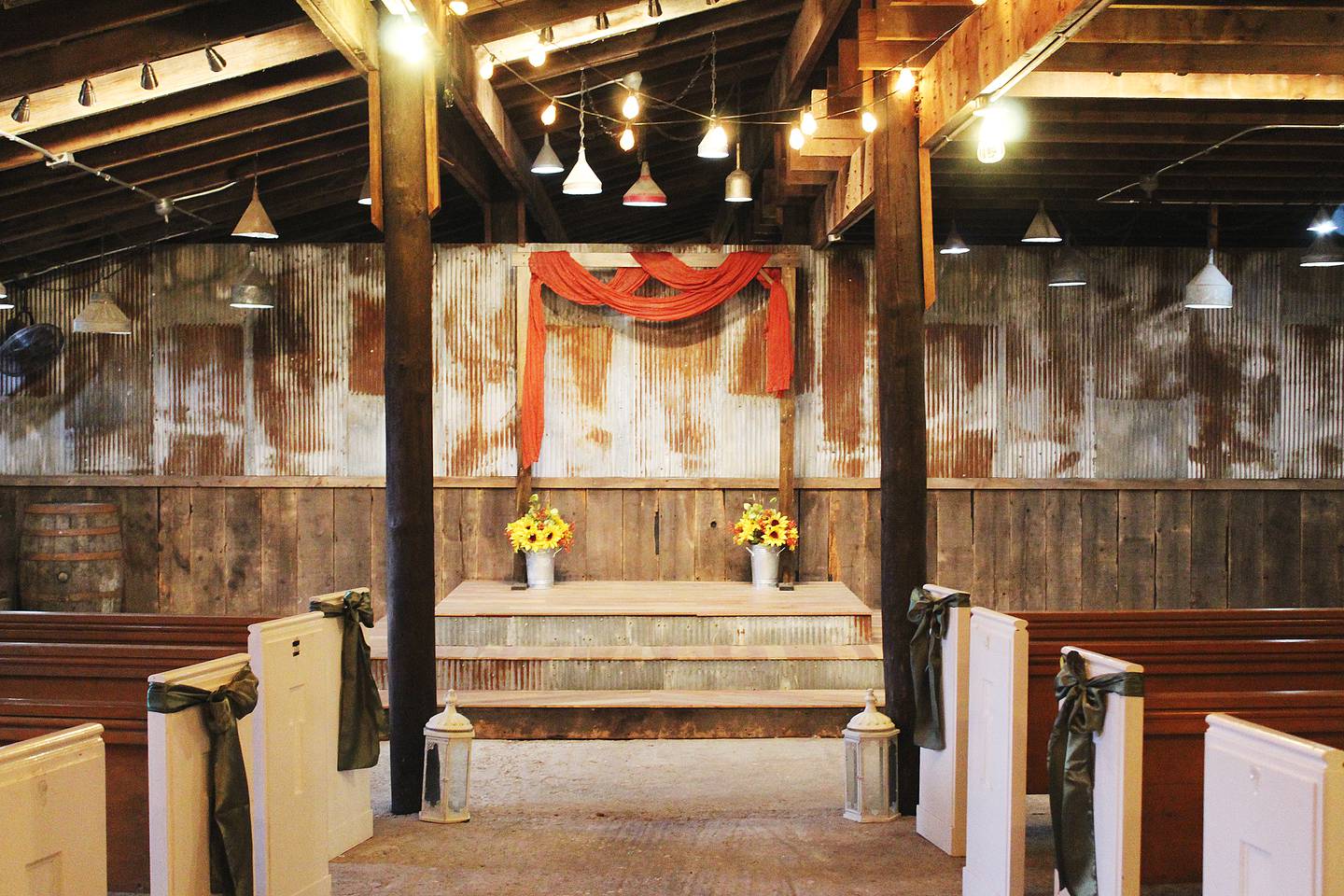 The back barn at Honey Bee Haven is a chapel for those who wish to have an indoor wedding; otherwise, open space between the barns provides an outdoor alternative.