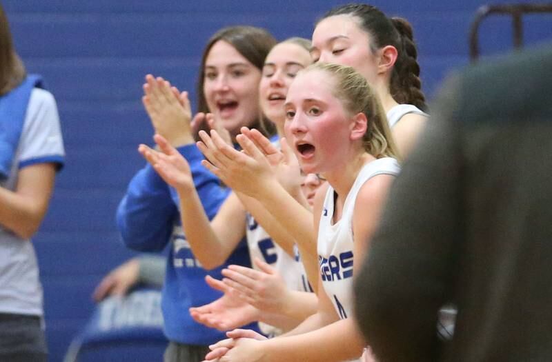 Members of the Princeton girls basketball team cheer on the Lady Tigers as they play Putnam County during the Princeton Holiday Girls Basketball Tournament on Tuesday, Nov. 19, 2024 at Princeton High School.
