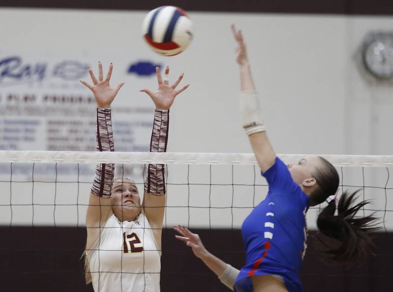 Richmond-Burton's Zoe Freund tries to block the spike of Lakes’ Addison Sundquist during a nonconference volleyball match on Monday, Sept. 29, 2025, at the Richmond-Burton High School in Richmond.