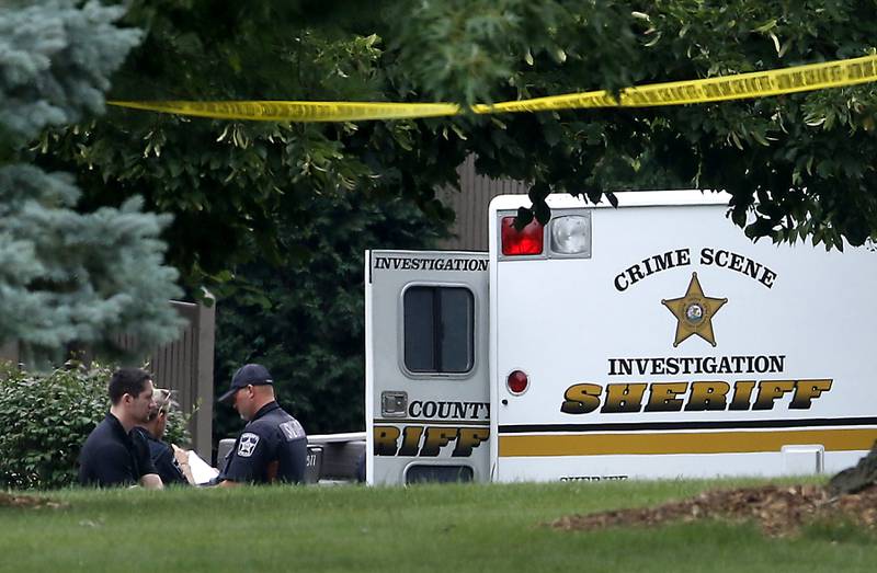 Officers from the McHenry County Sheriff and other departments investigate a domestic incident in which four people were killed on Wednesday Aug. 9, 2023, in the 5800 block of Wild Plum Road in unincorporated Crystal Lake. Police said they were family members.