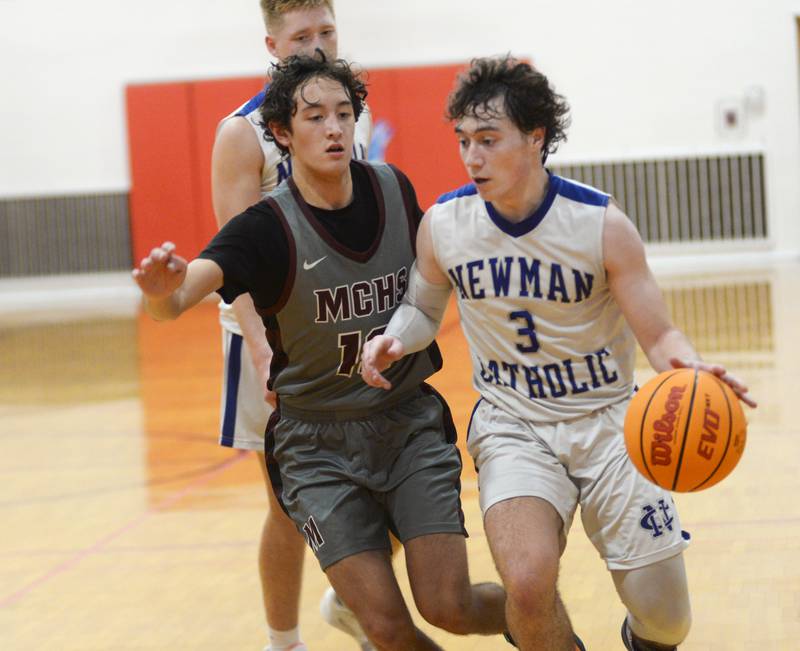 Newman's Garret Matznick (3) drives to the basket as Marengo's Myles Aukes (13) defends on Friday, Nov. 29, 2024 at the Oregon Thanksgiving Tournament in Oregon.