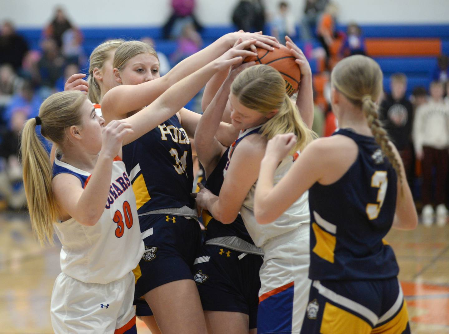 Polo's Sydnei Rahn (34) and Eastland's Ella Gunderson (12) and Morgan McCullough (30) battle for a rebound during a Tuesday, Feb. 6, 2024 game at Eastland High School in Lanark. Polo lost the game 40-24. Regional tournament action begins this week.