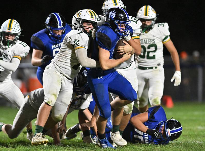 Peotone's Connor Pasch gets wrapped up by two Coal City defenders during a conference game on Friday, Sep 27, 2024 at Peotone. (Dean Reid for Shaw Local News)